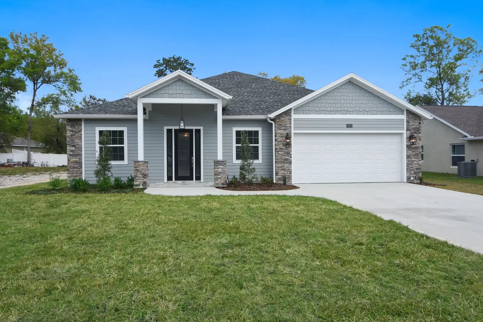 Completed Central Florida custom home with lawn and driveway