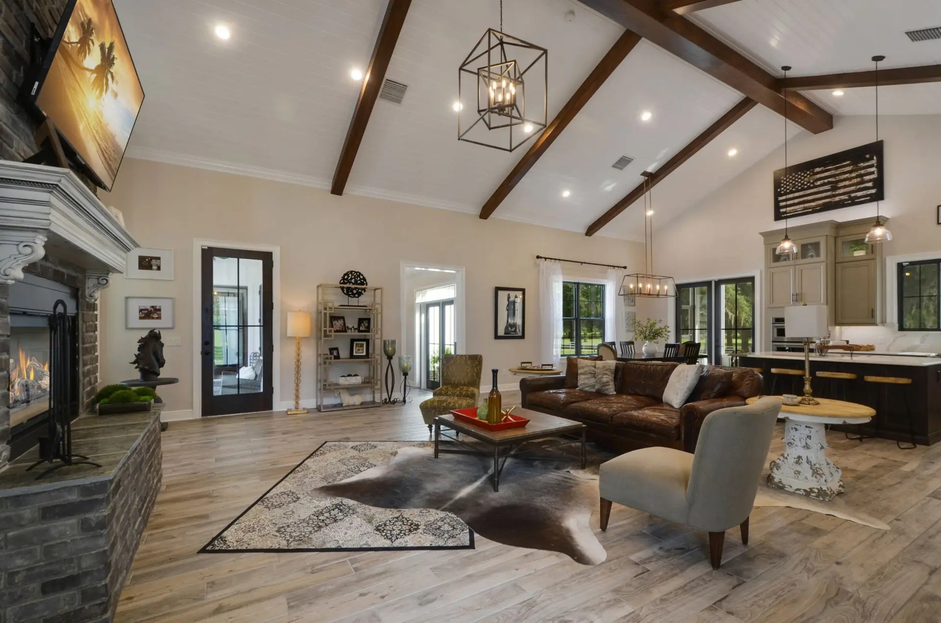 Finished McGinnis Builders living room with vaulted ceiling and wood beams
